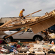 FOTO: Sled uničenja in smrti ostala za nevihto tornadov