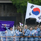 Južna Koreja besna, ker so njeno delegacijo med odprtjem OI predstavili kot severnokorejsko