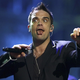 (FOTO in VIDEO) Robbie Williams jih ima 50! Njegovo življenje je danes povsem drugačno, kot je bilo nekoč